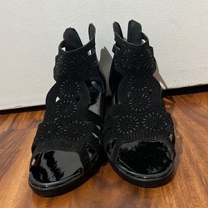 I’m selling black heels with gems on them.